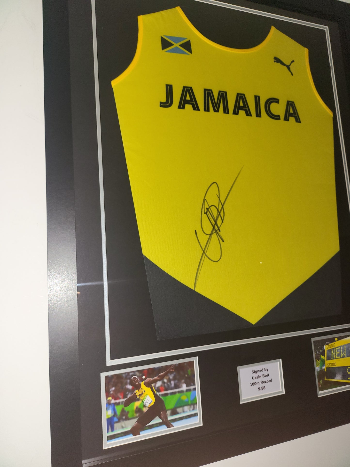 Usain Bolt signed Jamaica Framed Bib Shirt with COA